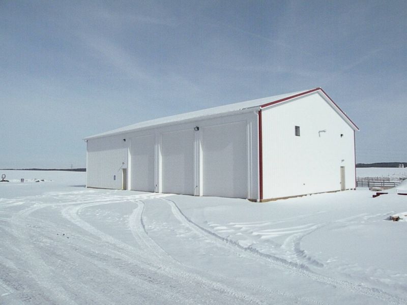 020711 New building rises from the ashes of the Care Center barn