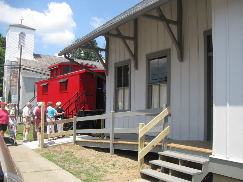 0725 Depot and caboose on board for historical journey in Smithville