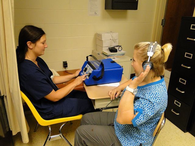 Adult practical nursing students assist with screenings