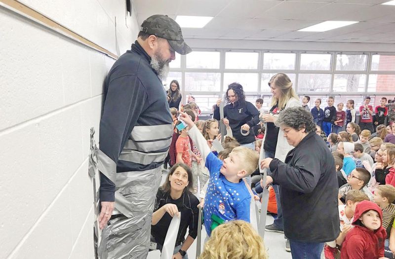 Berlin students take time in ‘sticking’ it to staff members