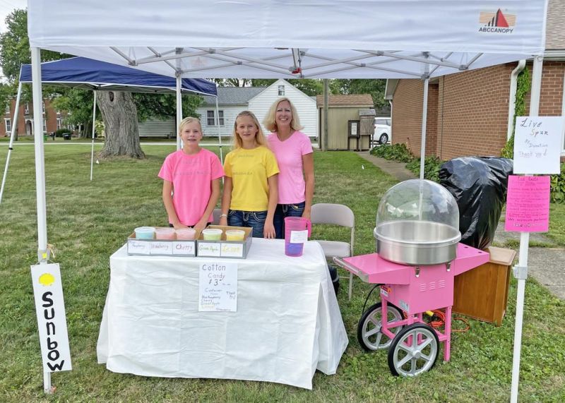 Dalton girl sells cotton candy with eye on the sky