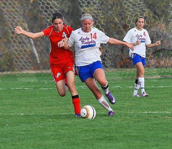 District title squared Lady Knights win on the pitch over Minerva as records fall