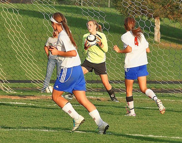 District title squared Lady Knights win on the pitch over Minerva as records fall