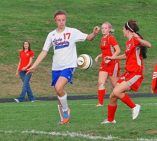 District title squared Lady Knights win on the pitch over Minerva as records fall