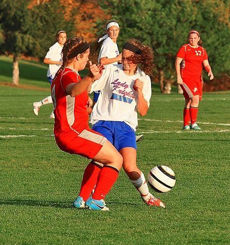 District title squared Lady Knights win on the pitch over Minerva as records fall