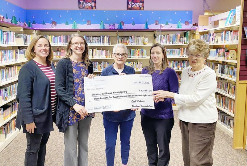 East Holmes teachers donate to Friends of Library