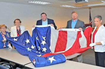 Emblem Club donates courthouse flag