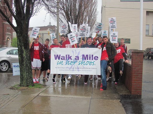 Football team volunteers to walk a mile in womens shoes to raise awareness about violence against women