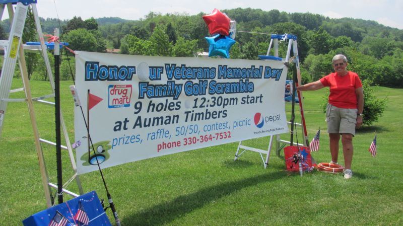 Giant flag overlooks green as veterans are honored at golfing event to benefit Walter Reed Hospital