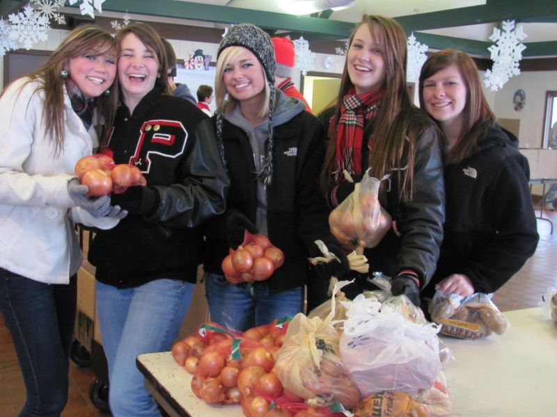Gifts of food, toys, and clothing help to brighten Christmas for families