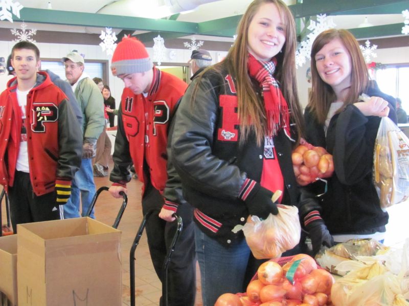 Gifts of food, toys, and clothing help to brighten Christmas for families