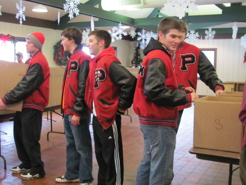 Gifts of food, toys, and clothing help to brighten Christmas for families