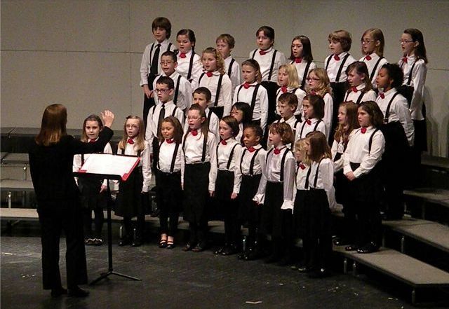 Members of the Childrens Chorus lift their voices in song