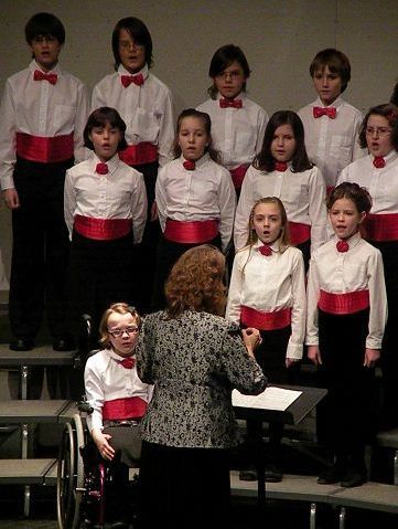 Members of the Childrens Chorus lift their voices in song