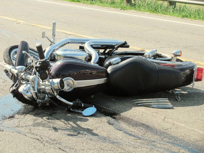 Motorcyclists collision with pickup truck results in fatality; numerous emergency personnel assist at the scene