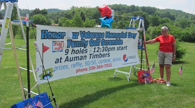 Old Glory overlooks green as veterans are honored at golfing event