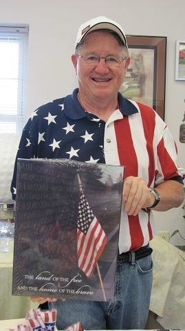 Old Glory overlooks green as veterans are honored at golfing event