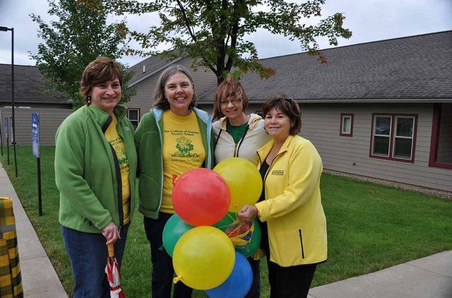 Student groups and others walk in COW Homecoming Parade