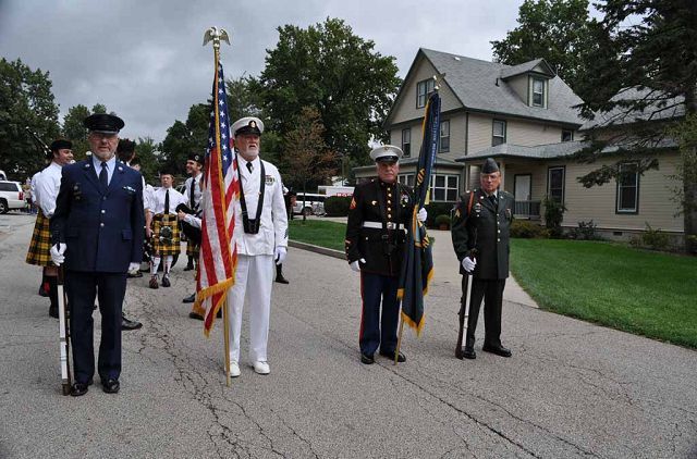 Student groups and others walk in COW Homecoming Parade