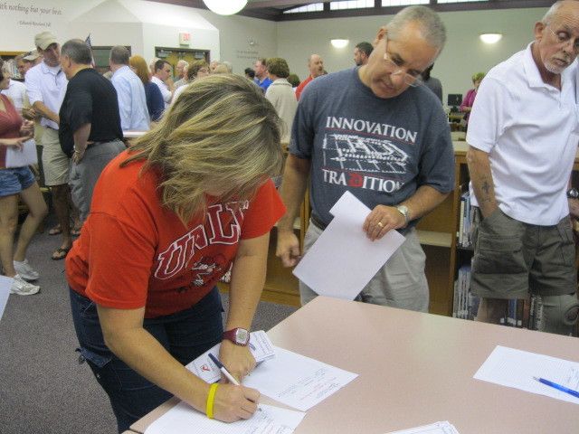 Supporters for new Dover High School share facts at rally