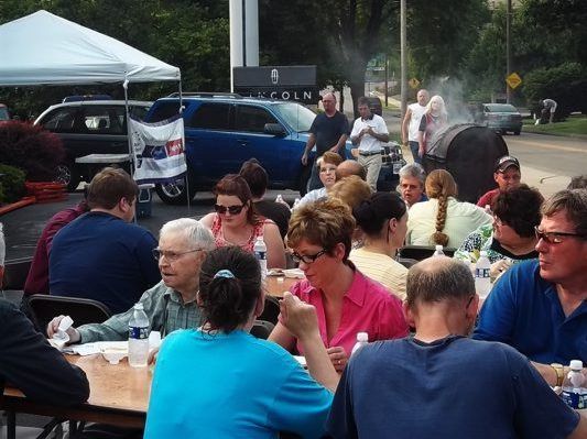 Village Motors drives away cancer with Relay for Life hog roast