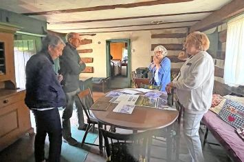 Visitors tour Bimeler Cabin in Zoar for the first time