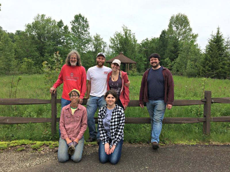 Volunteers plant trees and remove invasive species from Gnaden Nature Center